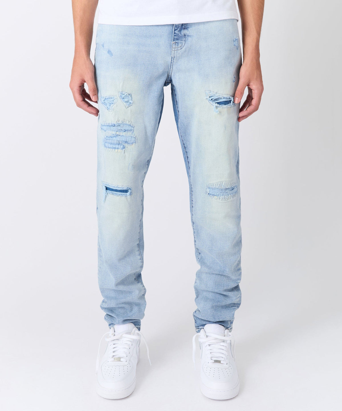 Ripped And Repaired Washed Denim Jeans - Light Blue