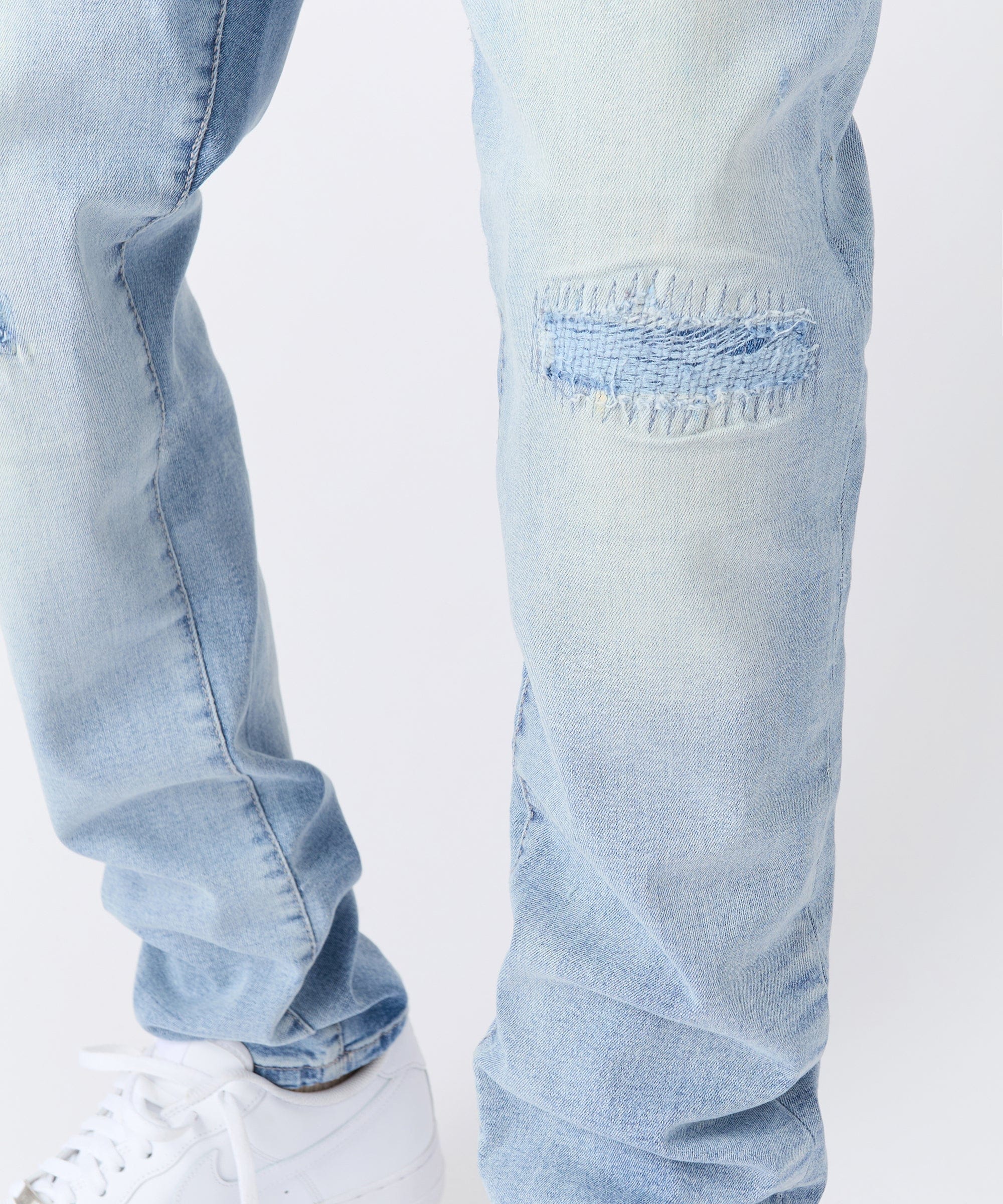 Ripped And Repaired Washed Denim Jeans - Light Blue